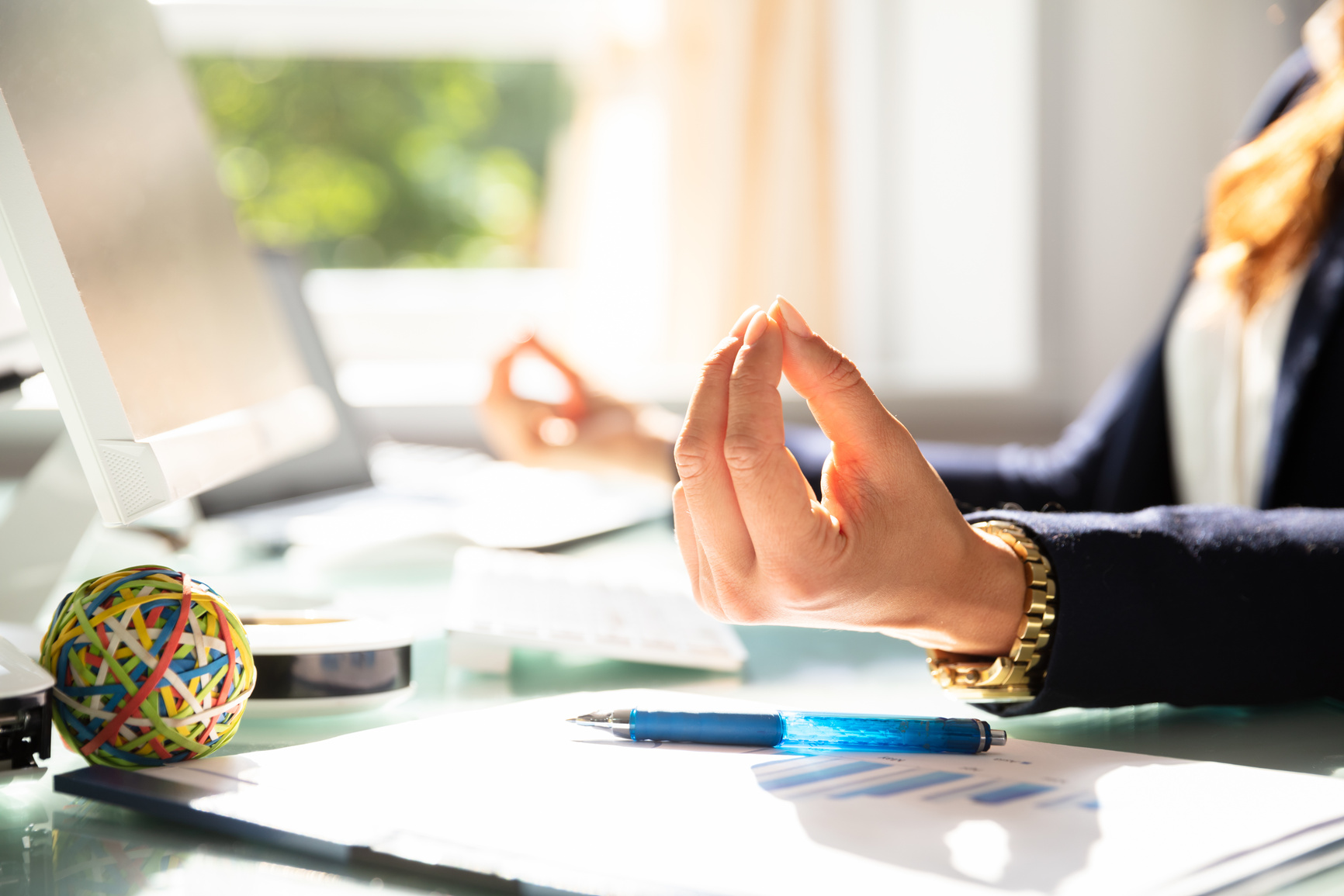 Businesswoman Meditating In Office