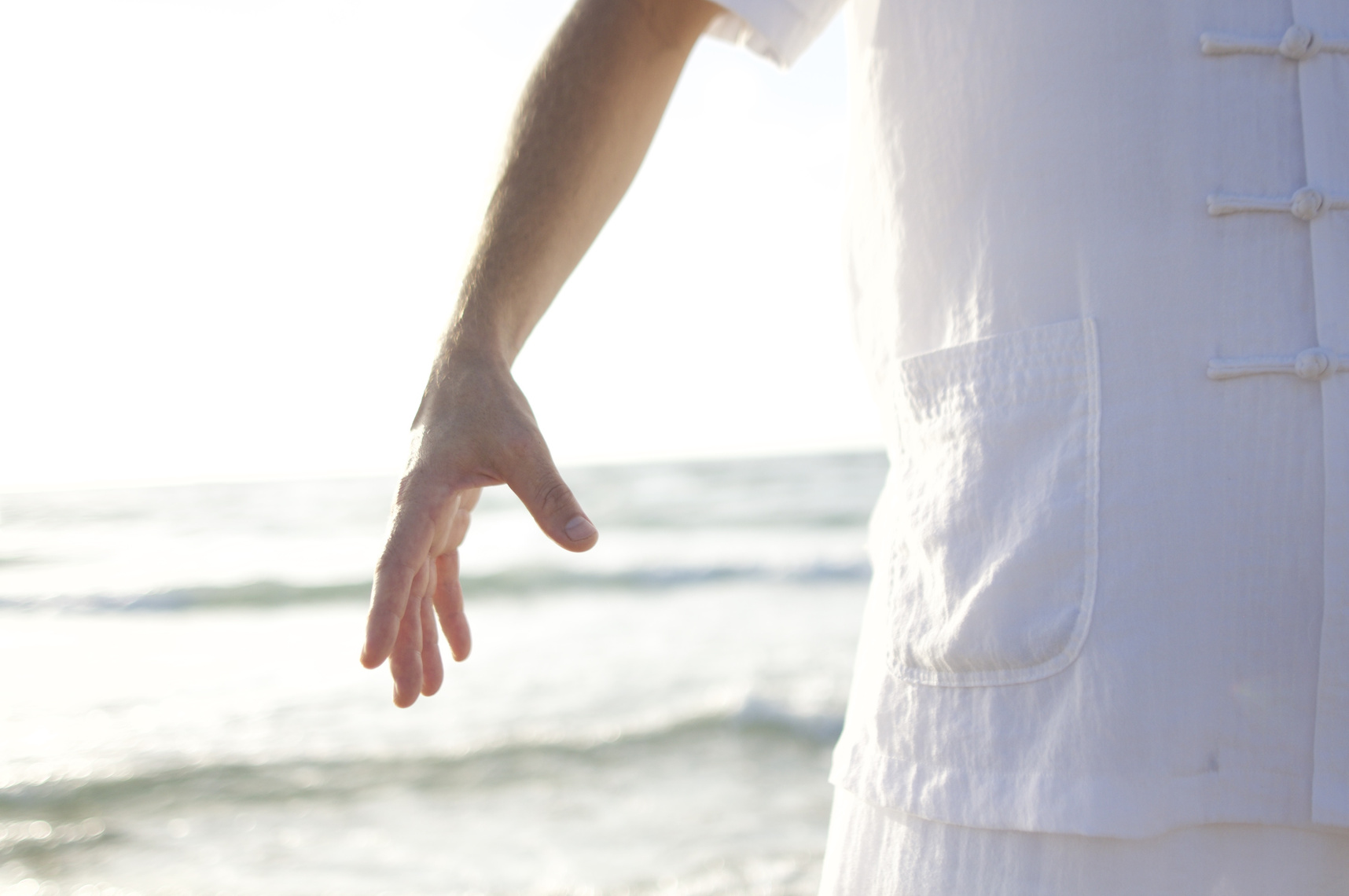 Man Practicing Qigong at the Beach